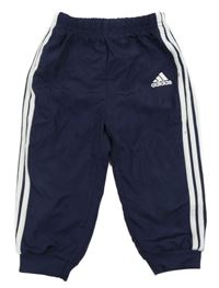 Tmavomodré šusťákové sportovní kalhoty Adidas