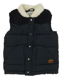 Tmavomodrá prošívaná šusťákovo/manšestrová zateplená vesta s nášivkou Matalan