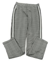 Černo-bílé vzorované tregíny s proužkem 