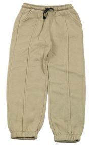 Béžové tepláky Tu