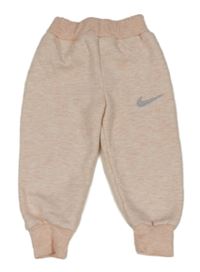 Světlerůžové cuff podšité tepláky s logem Nike