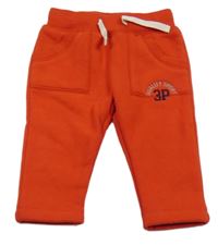 Červené teplé tepláky s číslem a nápisem 