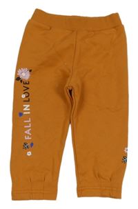 Oranžové tepláky s nápisem Prigmi 