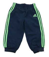 Tmavomodré šusťákové sportovní kalhoty s logem Adidas