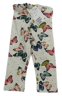 Smetanové tepláky s motýly H&M