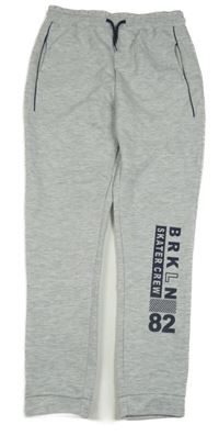 Světlešedé melírované tech fleece tepláky s nápisy a číslem Y.F.K.