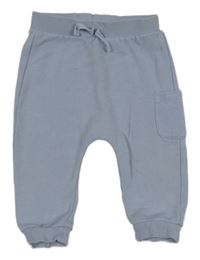 Světlemodré tepláky s kapsou Tu