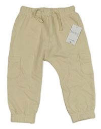 Nové - smetanové tepláky s kapsičkami Matalan