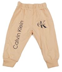 Meruňkové tepláky s logem Calvin Klein