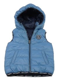 Modrá šusťáková prošívaná zateplená oboustranná vesta s kapucí C&A