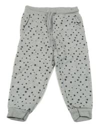 Šedé melírované puntíkaté tepláky lupilu