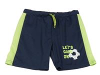 Tmavomodré sportovní kraťasy se zeleným pruhem a míčem 