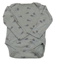 Šedé body se lvy Next