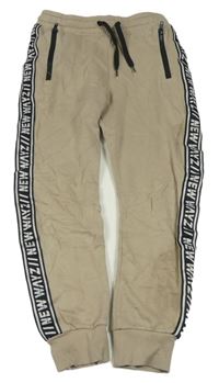 Béžové chino tepláky s pruhem s nápisy zn. H&M