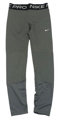 Šedé funkční sportovní legíny Nike 