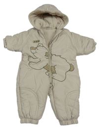 Béžová šusťáková zimní kombinéza s medvědem a kapucí 
