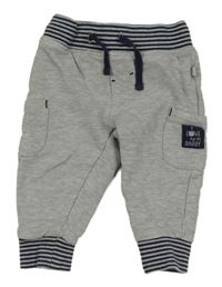 Šedé tepláky s tmavomodrým pasem a kapsami Liegelind