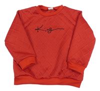 Červená vzorovaná mikina s nápisem