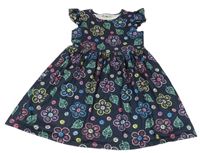 Tmavomodro-barevně puntíkaté šaty s květy a lístečky a volánky