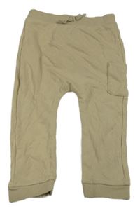 Světlebéžové tepláky s kapsou Tu