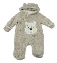 Béžovo-bílá chlupatá kombinéza s medvídkem a kapucí Disney
