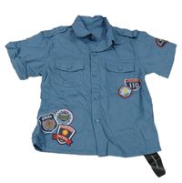 Nové - Modrá košile s nášivkami St. Bernard