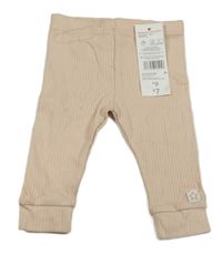 Nové - Broskvové žebrované tepláky F&F