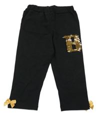 Černé capri legíny s písmenem z překlápěcích flitrů a mašlemi