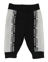 Černo-bílé sportovní tepláky s logem Adidas