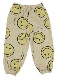 Béžové tepláky se smajlíky H&M